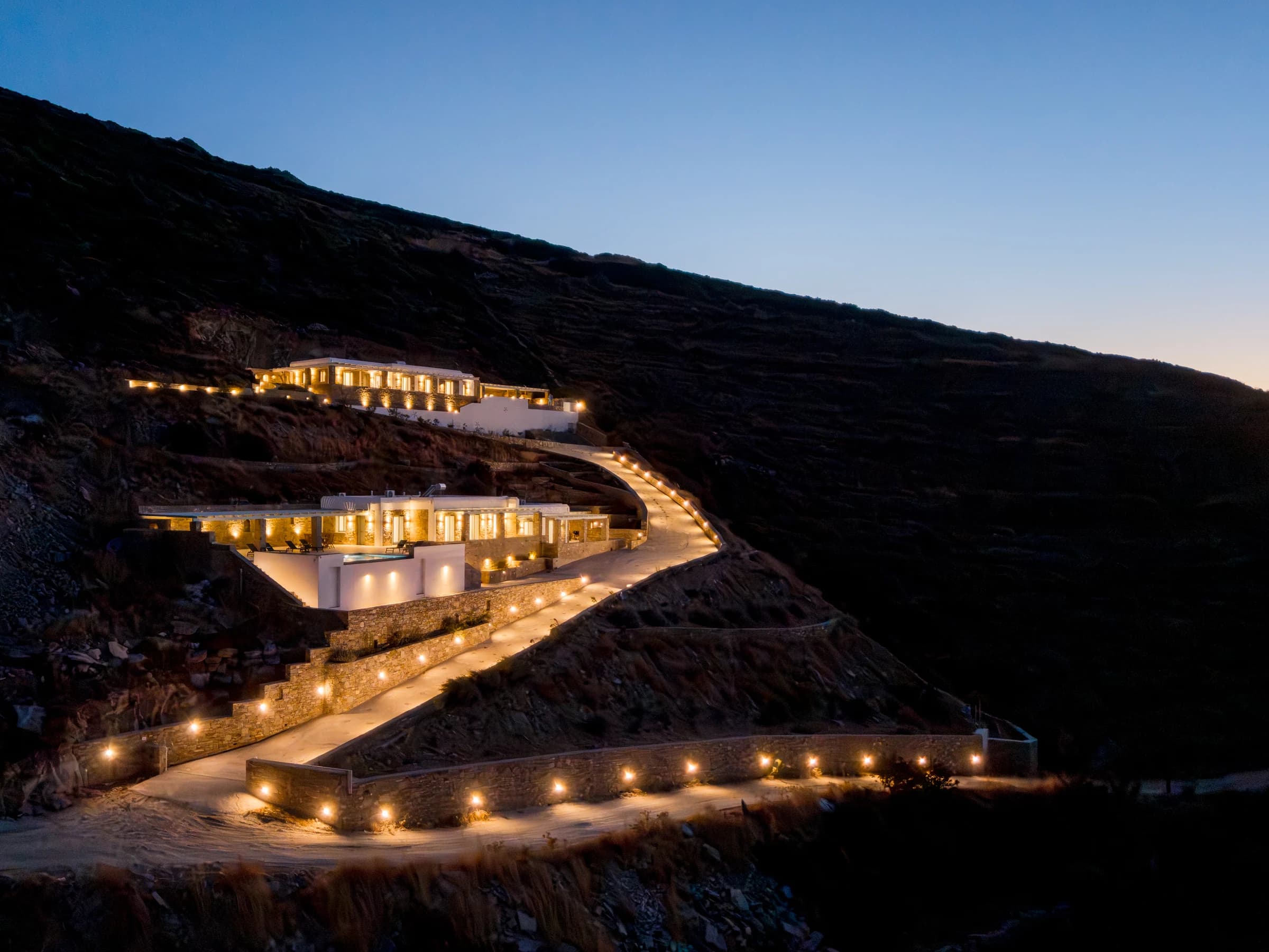 Both Theasis Estates — illuminated hillside arrival