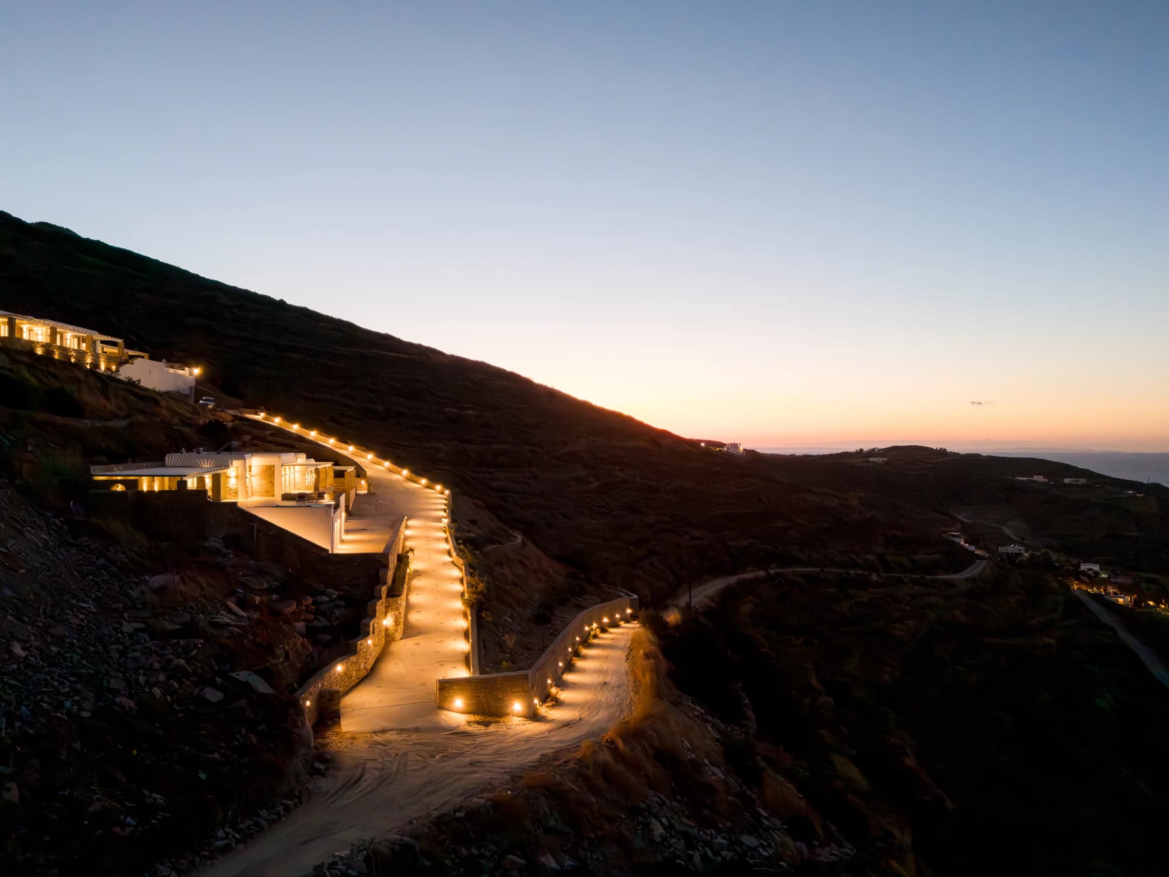 Both Theasis Estates — illuminated hillside arrival
