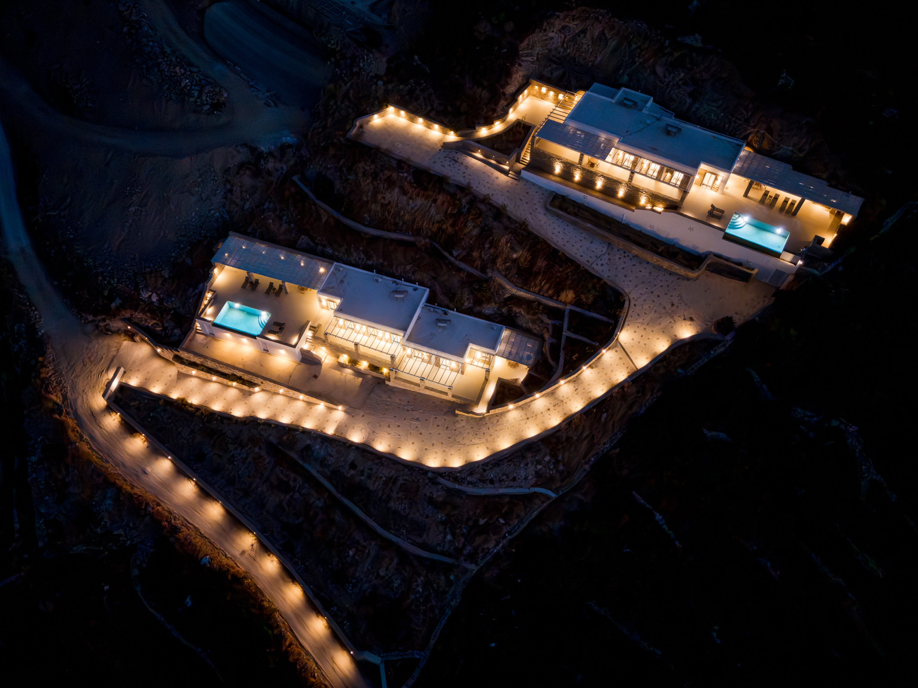 Both Theasis Estates — illuminated hillside arrival